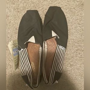 Tom’s Slip on shoes. Black and white. New with tags